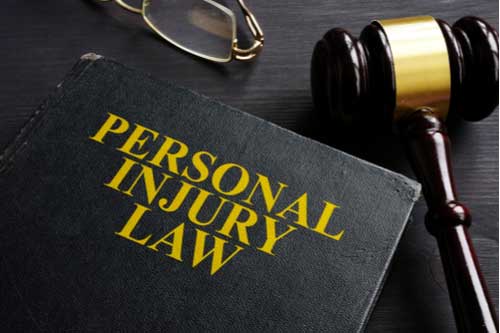 Personal injury law book and judge gavel, Boise personal injury lawyer concept